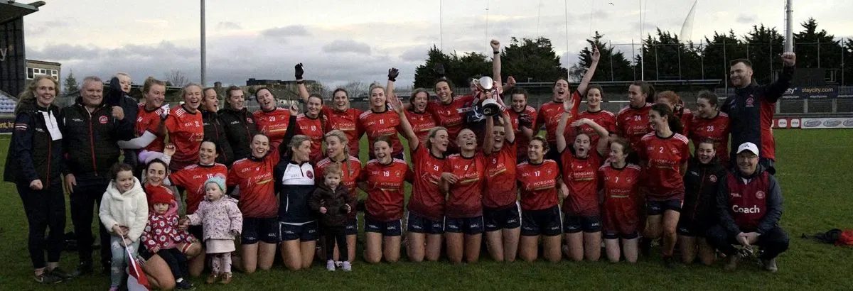 Mungret St Paul's players celebrating with the cup in Horgans-sponsored jerseys