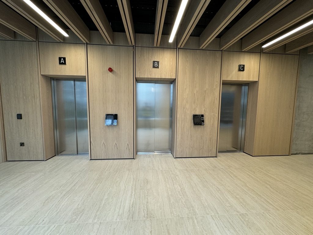 Three-lift destination control group in the 1BQ lobby